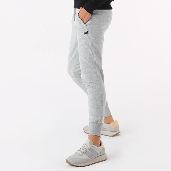 New Balance SPODNIE SMALL PACK SWEATPANTS WP23600AG